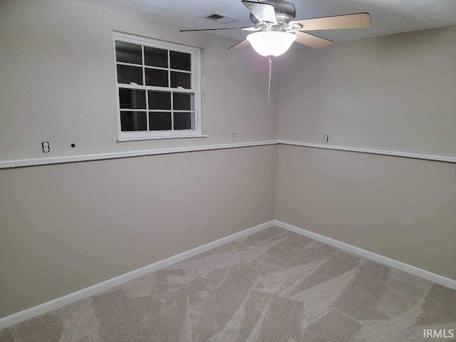 empty room featuring carpet flooring and ceiling fan