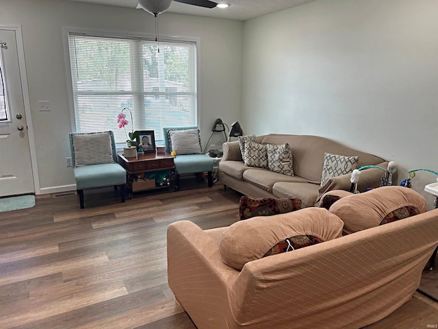 living room with hardwood / wood-style flooring and ceiling fan