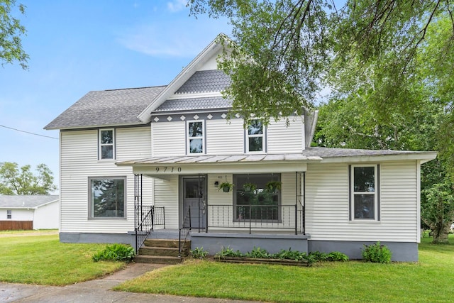 view of front facade featuring a porch and a front lawn