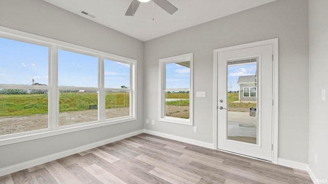 interior space featuring plenty of natural light and ceiling fan