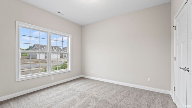 unfurnished room with carpet flooring