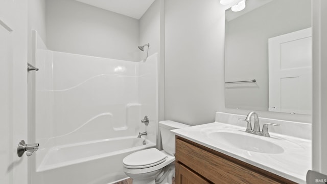 full bathroom with vanity, shower / bathtub combination, and toilet