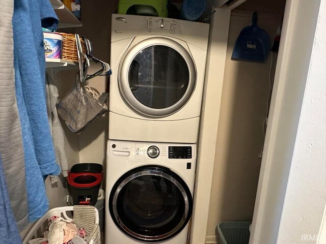 laundry room with stacked washer and clothes dryer