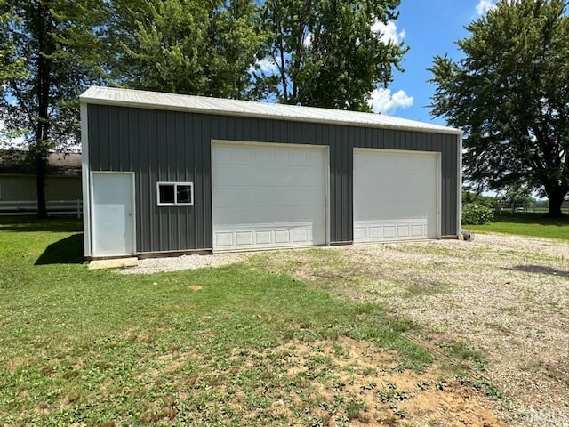 garage with a yard