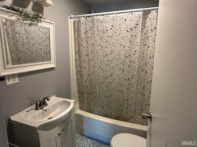 full bathroom with shower / bathtub combination with curtain, vanity, and toilet