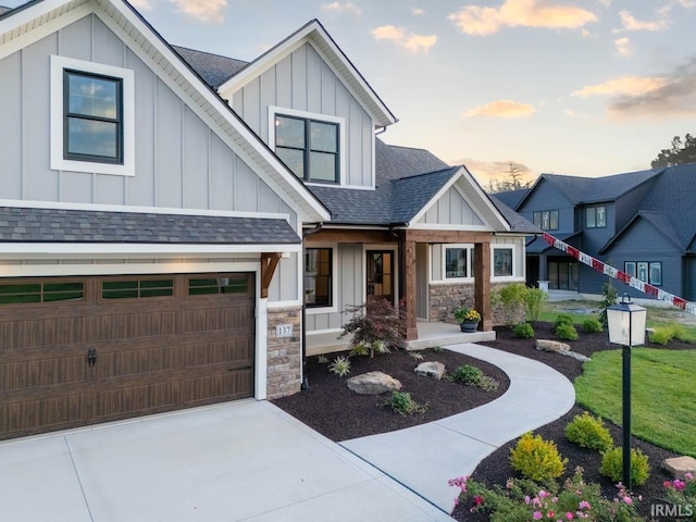 view of front facade with a lawn and a garage