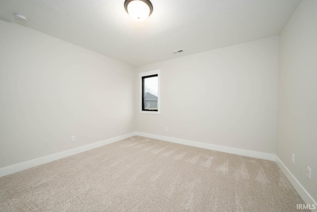 137 W Basalt Dr, Huntertown, IN 46748 - spare room with light carpet, baseboards, and visible vents
