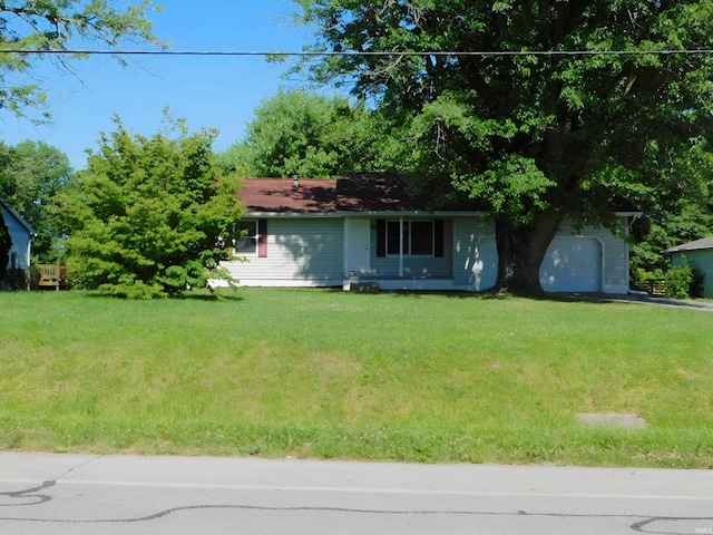 ranch-style home with a front yard and a garage