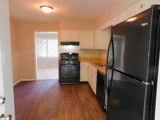 kitchen with white cabinetry, dark wood-type flooring, and black appliances