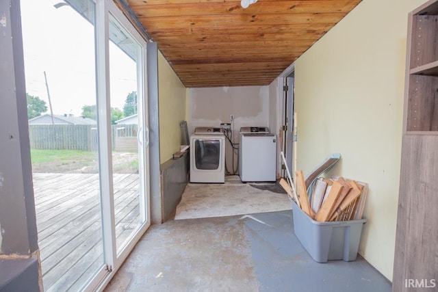 laundry area featuring washer and dryer and wood ceiling