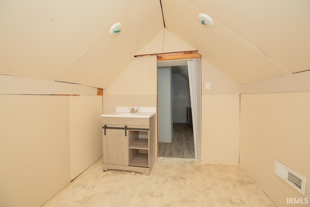 additional living space with lofted ceiling and sink