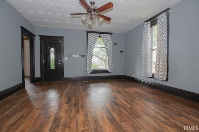 foyer featuring ceiling fan and dark wood-type flooring