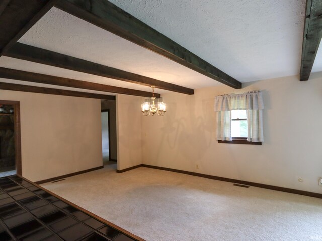 carpeted empty room with a textured ceiling, beam ceiling, and an inviting chandelier