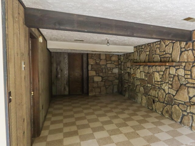 basement with a textured ceiling