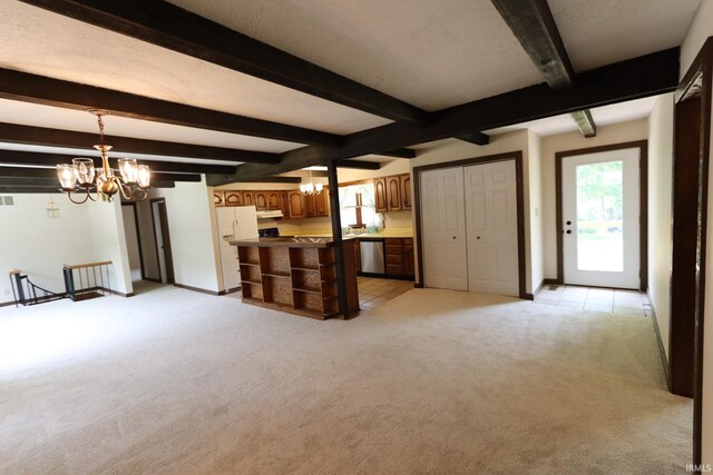 unfurnished living room featuring light colored carpet, beam ceiling, and a notable chandelier