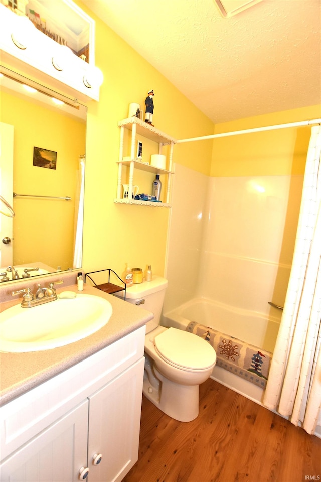 full bathroom with vanity, toilet, shower / bathtub combination with curtain, and wood-type flooring