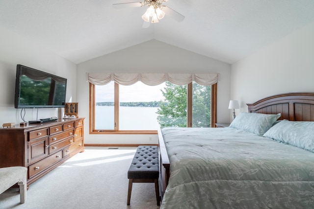 bedroom featuring lofted ceiling, carpet, and ceiling fan