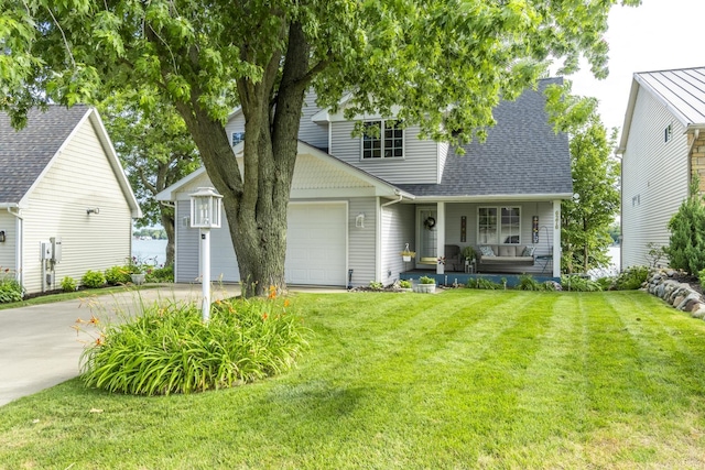 view of front of home with covered porch, a garage, a shingled roof, driveway, and a front yard