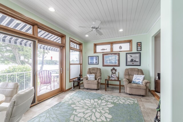 sunroom / solarium with wood ceiling and ceiling fan