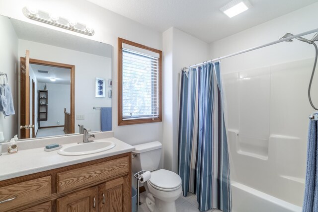 full bathroom with vanity, toilet, shower / bath combo, and tile patterned flooring