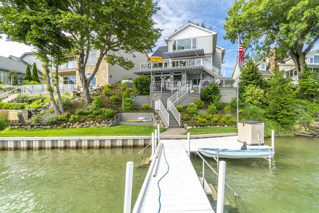 dock area featuring a deck with water view