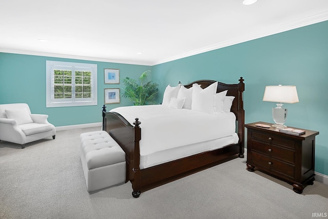 bedroom with baseboards, recessed lighting, light colored carpet, and crown molding