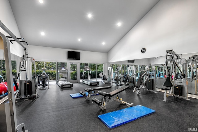 gym with high vaulted ceiling and recessed lighting