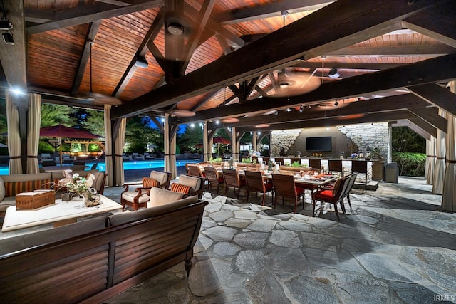 view of patio / terrace featuring an outdoor pool and a gazebo