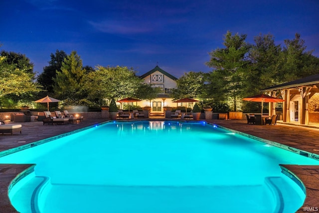 outdoor pool featuring an outdoor hangout area and a patio