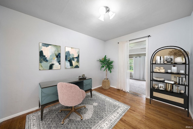 office area with wood-type flooring