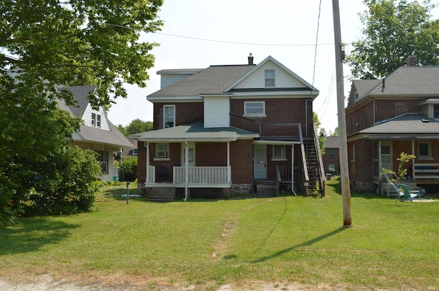 view of front of house featuring a porch and a front lawn