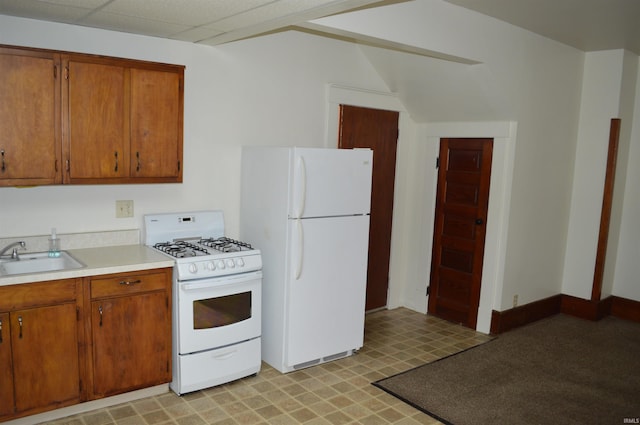 kitchen with sink and white appliances