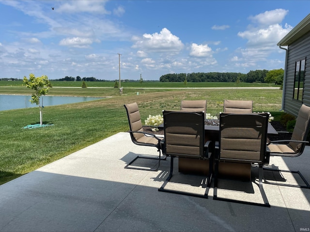 view of patio with a water view