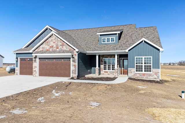 craftsman-style house with a garage and covered porch