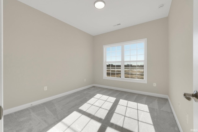 empty room featuring light colored carpet