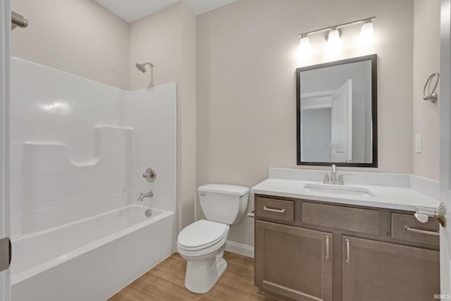 full bathroom with shower / washtub combination, toilet, wood-type flooring, and vanity