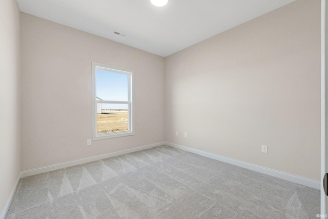 unfurnished room with light colored carpet