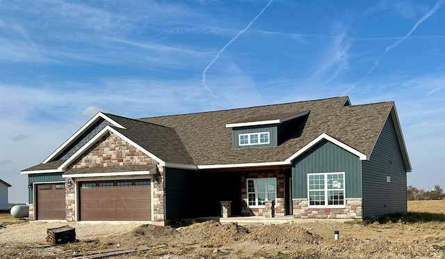 craftsman house featuring a garage and covered porch