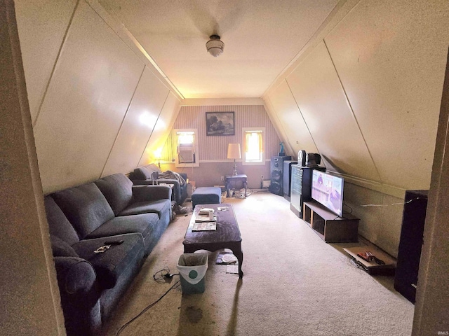 carpeted living room featuring lofted ceiling