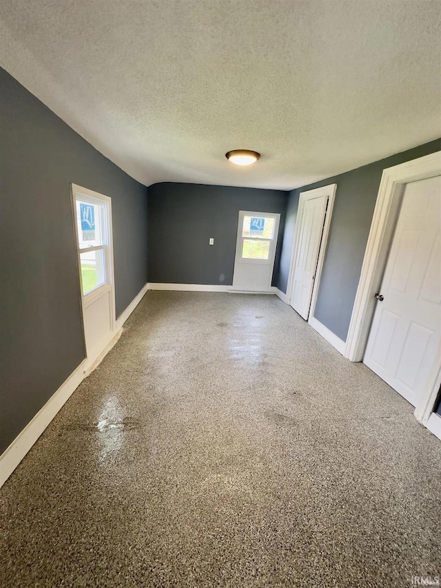 empty room featuring a textured ceiling