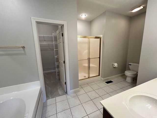 full bathroom featuring vanity, toilet, and separate shower and tub