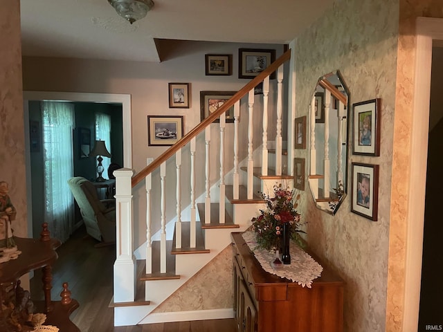 stairway featuring hardwood / wood-style flooring