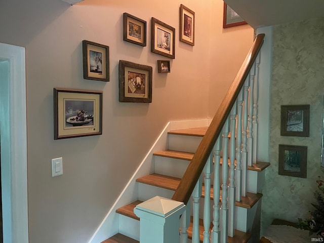 stairway featuring wood-type flooring