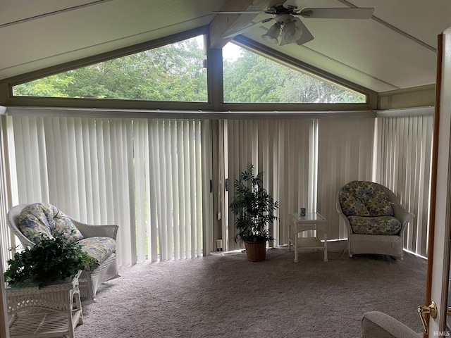 sunroom / solarium featuring vaulted ceiling with beams and ceiling fan