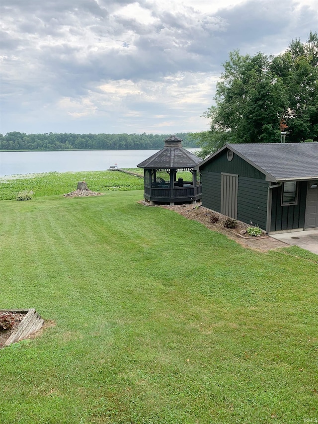 view of yard featuring a water view and a gazebo