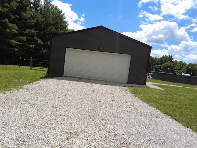 garage with a yard