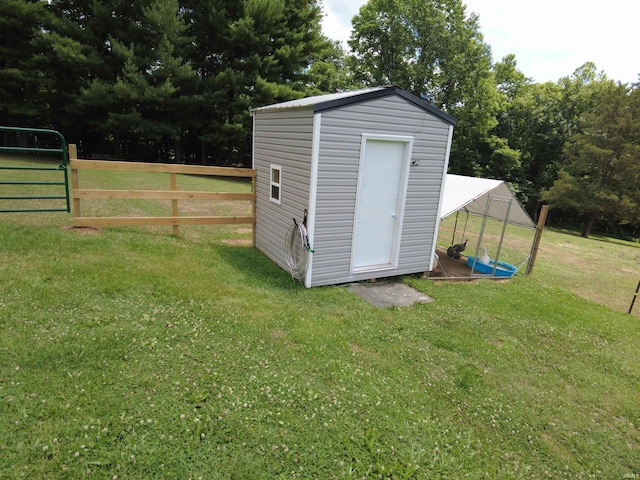 view of outdoor structure featuring a lawn