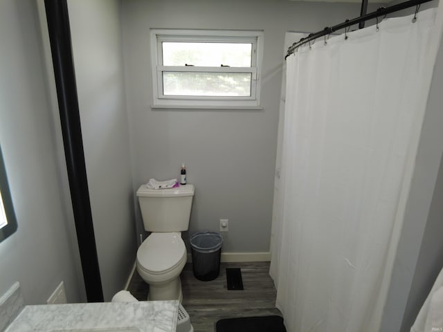 bathroom featuring a shower with shower curtain, vanity, toilet, and hardwood / wood-style floors