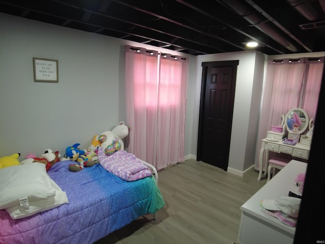 bedroom with light wood-type flooring