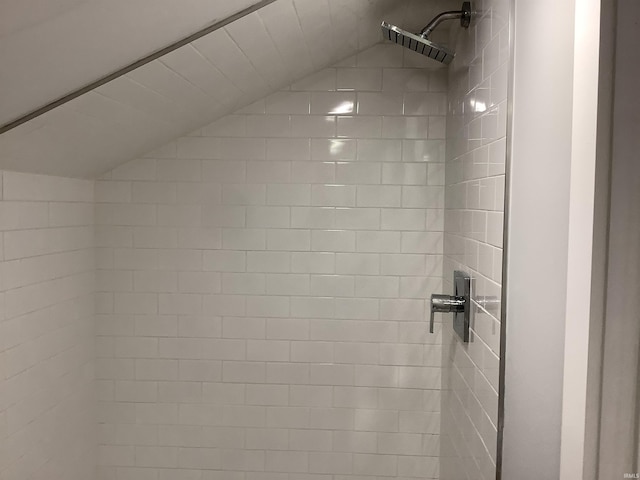 interior details featuring tiled shower